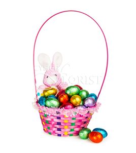 Easter Sweets. This marvelous Easter basket full of chocolates eggs accompanied by a nice rabbit will look great on a holiday table.